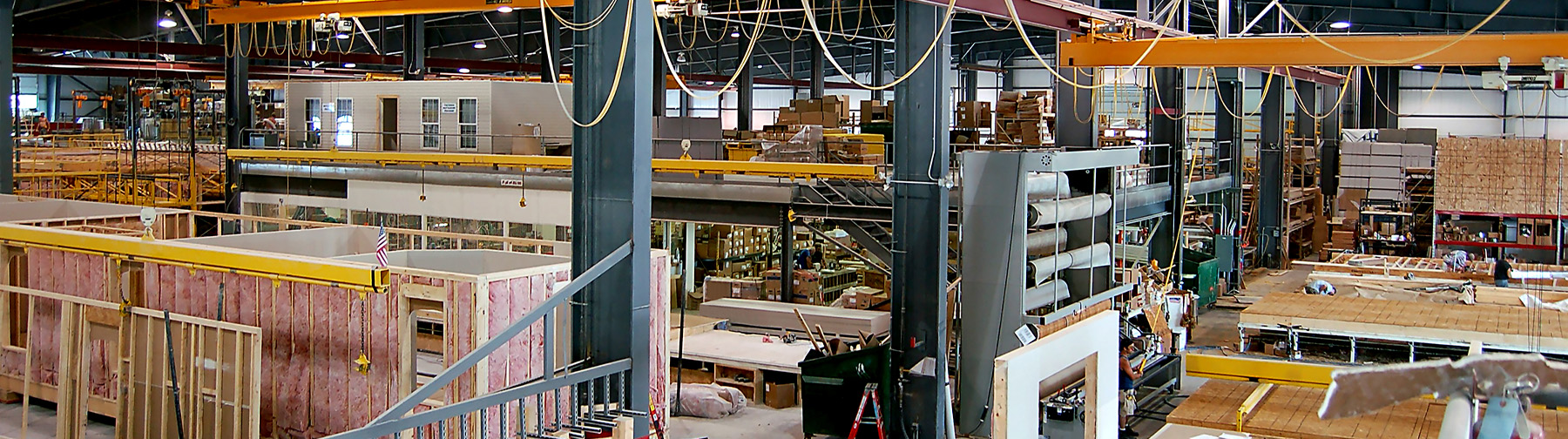 Modular buildings being constructed in a factory
