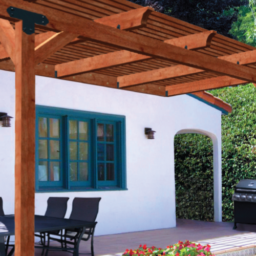 Wood patio cover attached to house providing shade.