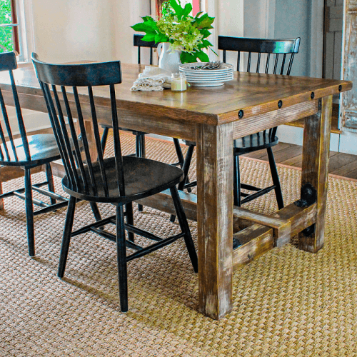 Dining chairs and faux barnwood table inside.