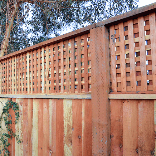 Wood lattice privacy fence.