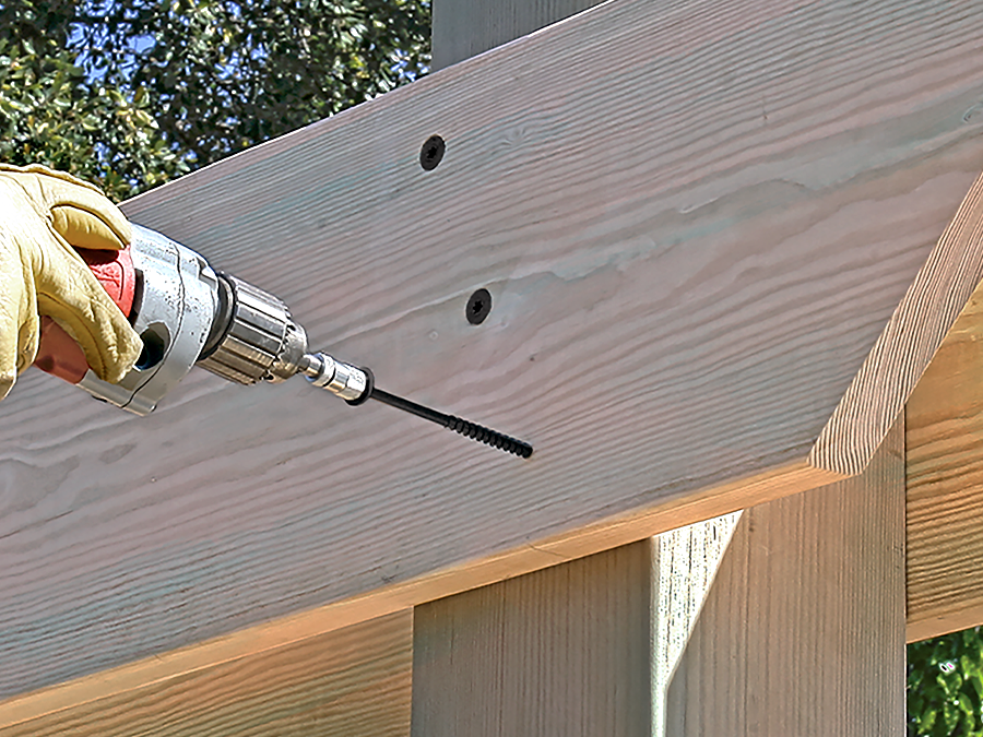 Exterior wood screws installed on a deck, highlighting their corrosion resistance.