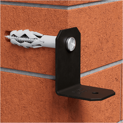 Gray plastic wall anchor and screw securing a black L-shaped metal bracket to a textured brick wall.