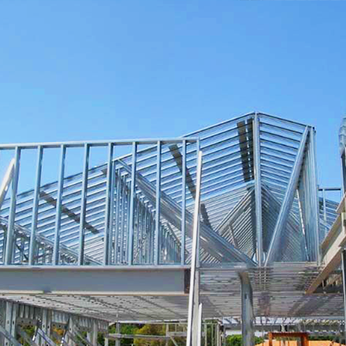 Cold-Formed Steel structure with a blue sky on a sunny day at a construction site.