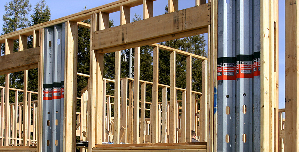 Single-story wood framed building utilizing Steel Strong-Walls