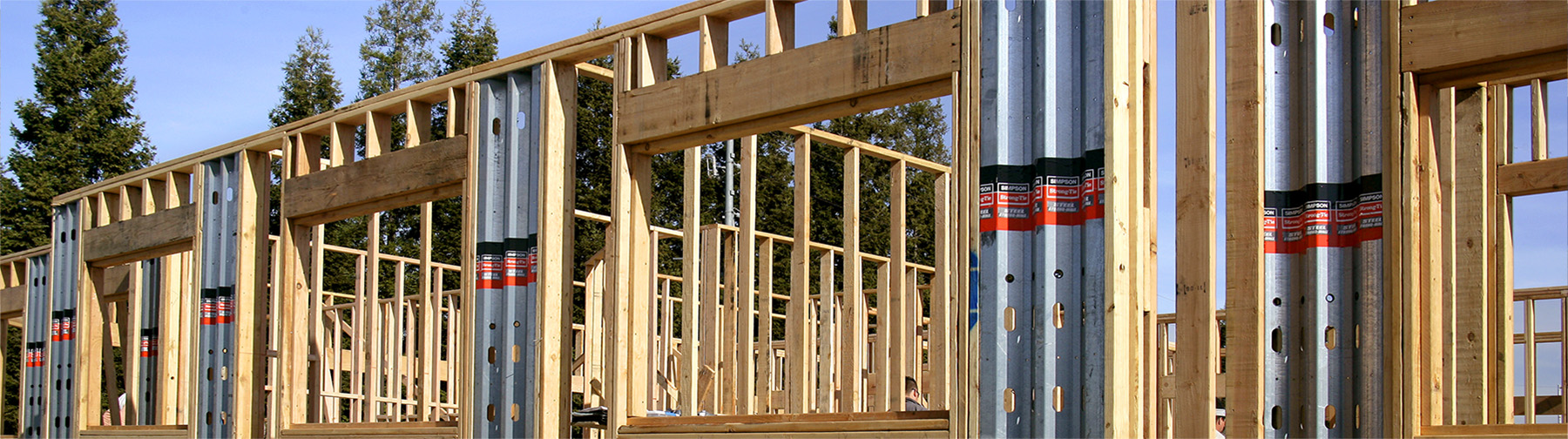 Single-story wood framed building utilizing Steel Strong-Walls