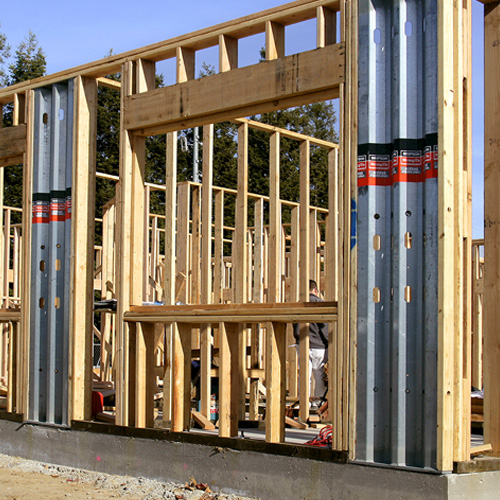 Single-story wood framed building utilizing Steel Strong-Walls