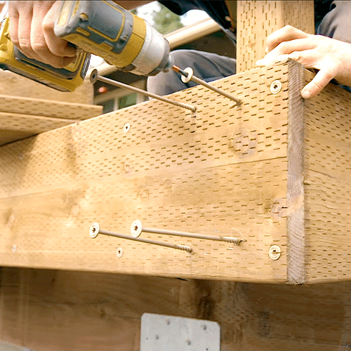 Deck joist being attached with Strong-Drive structural fasteners.