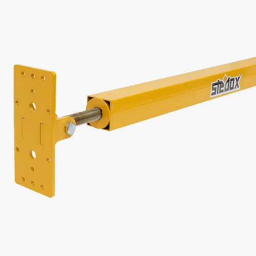 Yellow adjustable steel bracing support used for temporary stabilization in mass timber construction, with mounting plate and threaded rod.