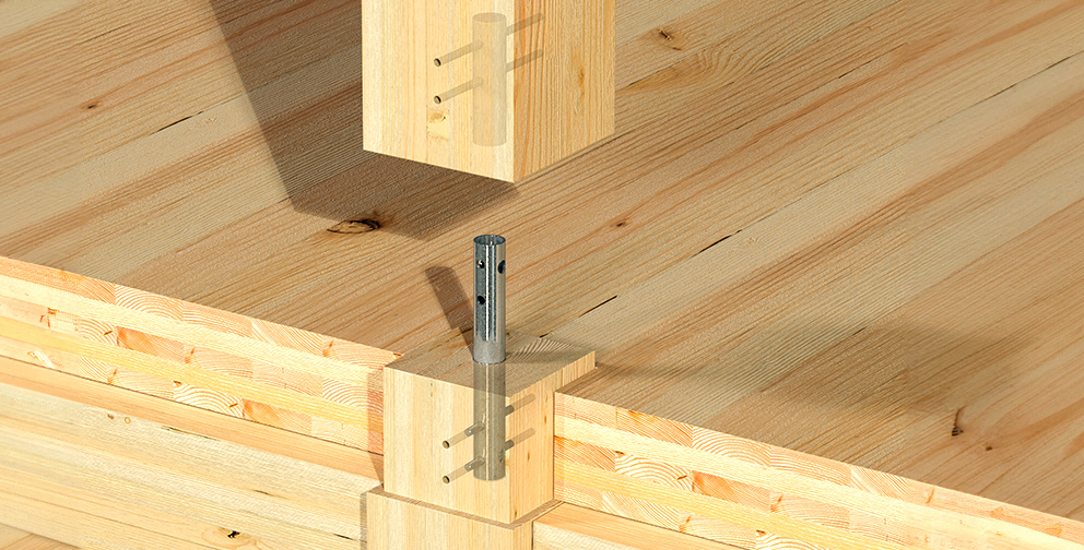 Close-up view of a mass timber column connection showing the alignment of wooden beams and a metal connector pin for structural support.