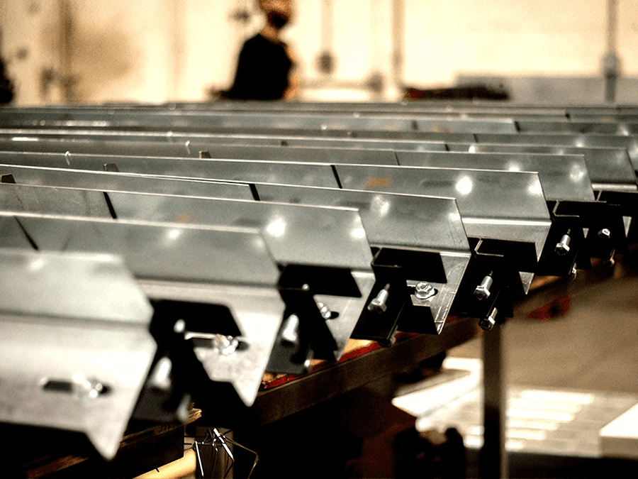 QuickFrames™ modular steel components arranged for assembly, highlighting pre-engineered parts designed to simplify support system installation.