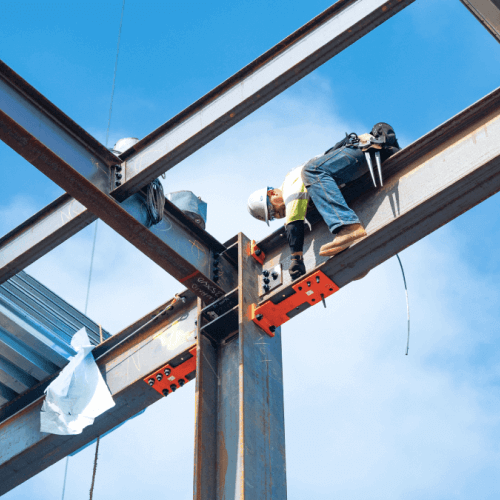 Construction worker installing Yield-Link Moment Connection.